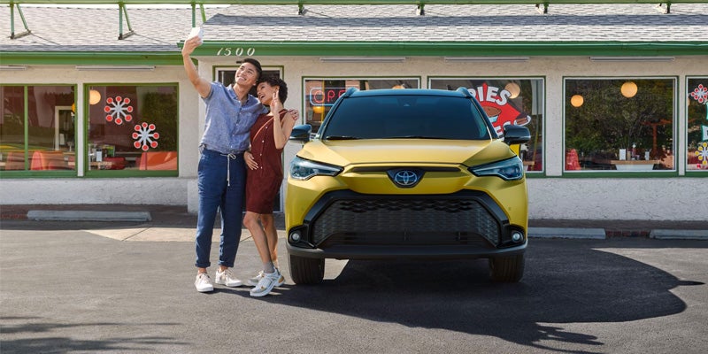 2024 Toyota Corolla Cross with couple taking selfie